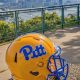 Pitt Football Helmet overlooking Pittsburgh