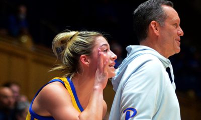 Marley Washenitz stands next to Pitt coach Lance White and calls out to her teammates at Duke on Feb. 2, 2023. (Mitchell Northam / Pittsburgh Sports Now)